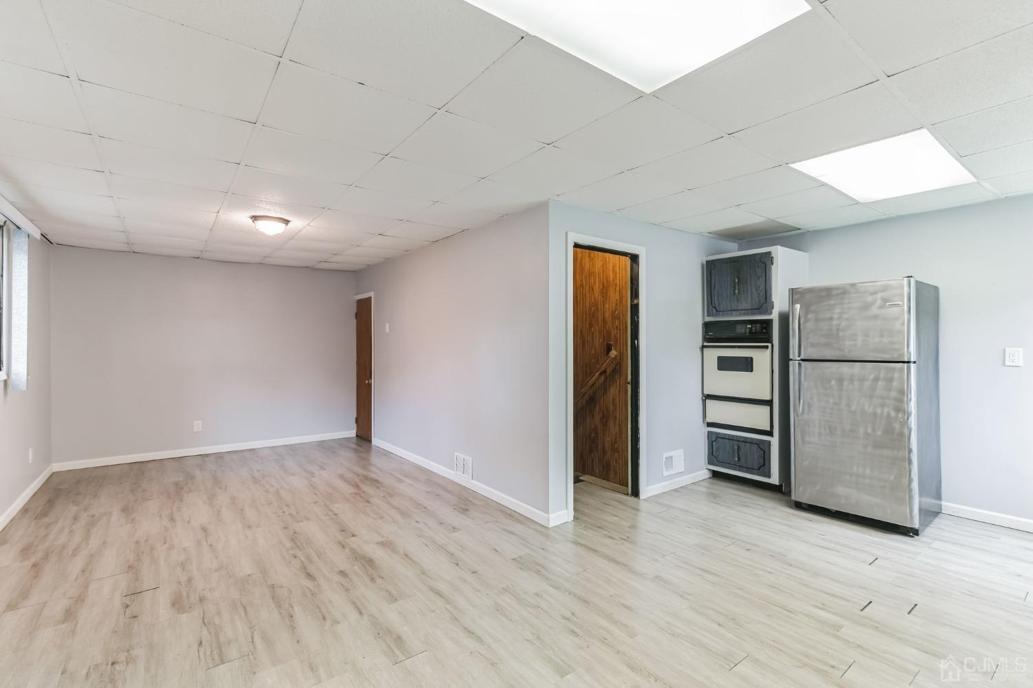 129 Princeton Road Old Bridge, NJ 08859 - Photo 8 of 26 wooden floor in an empty room