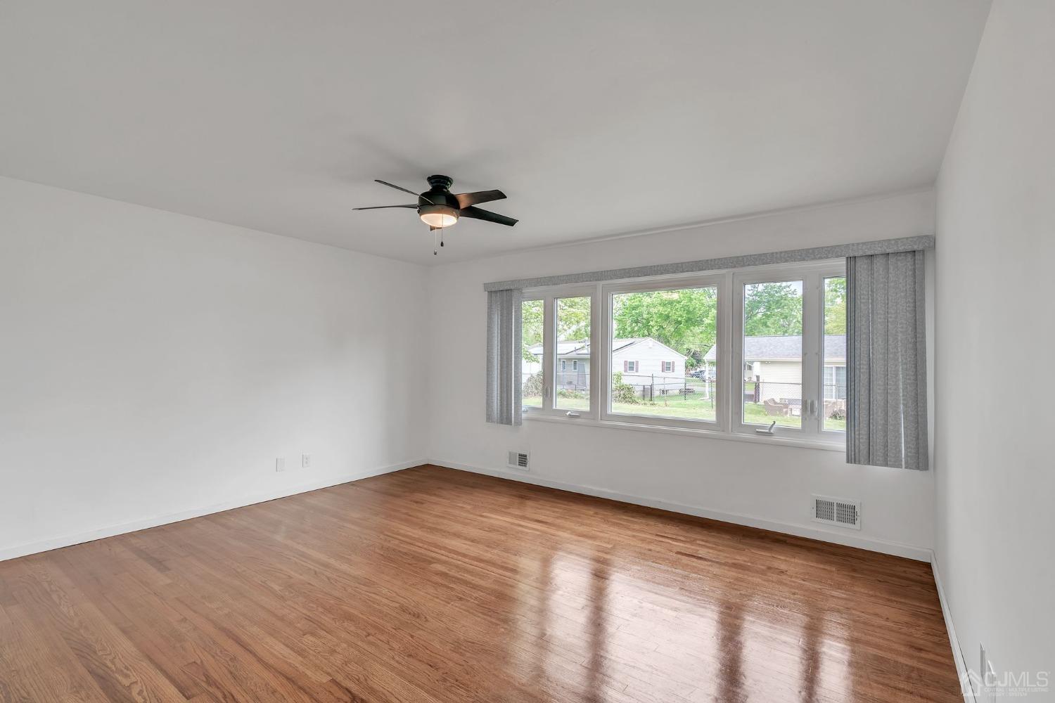 129 Princeton Road Old Bridge, NJ 08859 - Photo 10 of 26 a view of an empty room with a window