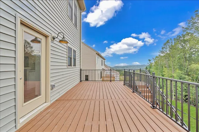 a view of a balcony with wooden floor