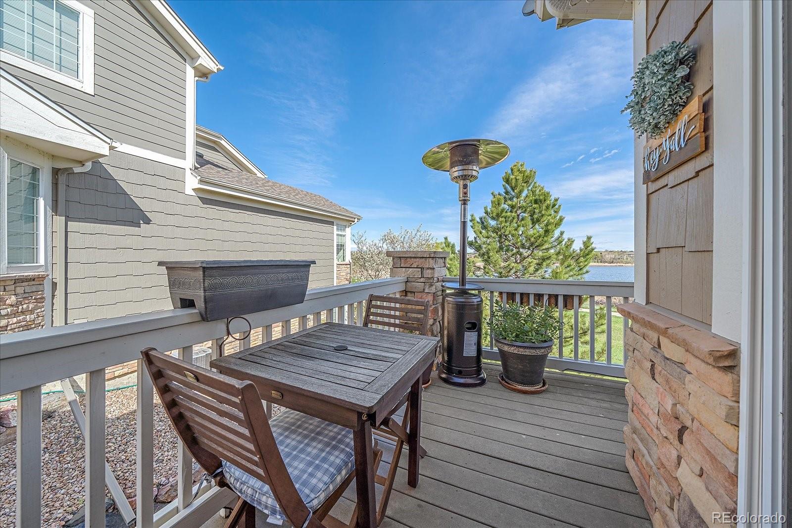 13721 Plaster Point, Unit 102 Broomfield, CO 80023 - Photo 18 of 35 a view of a wooden chairs on the deck