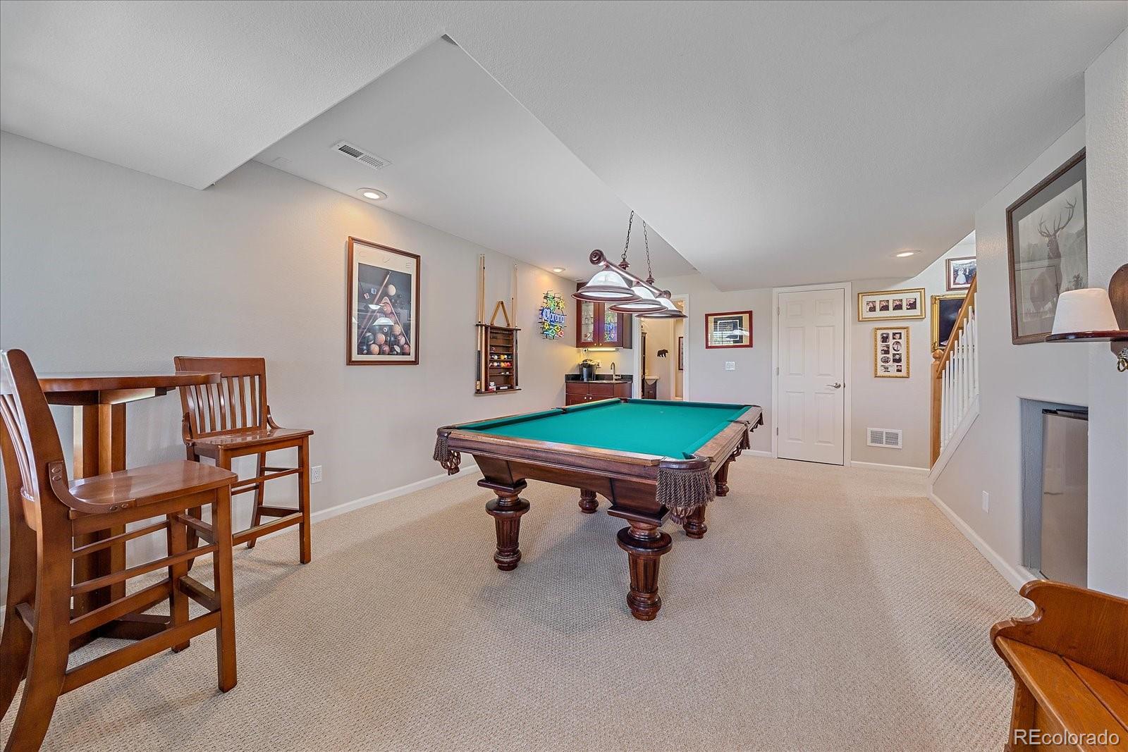 13721 Plaster Point, Unit 102 Broomfield, CO 80023 - Photo 24 of 35 a room with furniture pool table and window