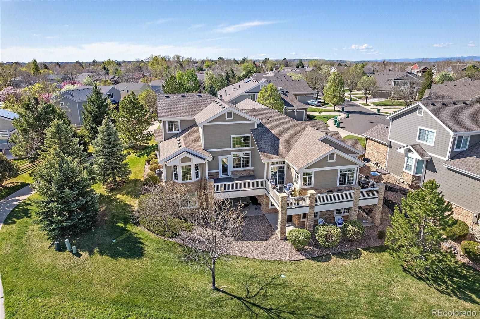 13721 Plaster Point, Unit 102 Broomfield, CO 80023 - Photo 32 of 35 an aerial view of a house with a big yard