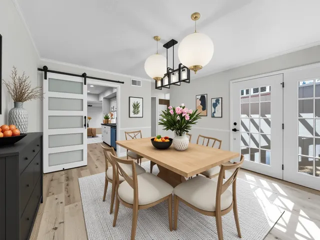 a view of a dining room with furniture and wooden floor