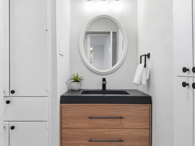 a bathroom with a sink and a mirror