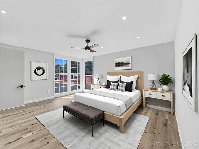 a bedroom with a large bed and a window