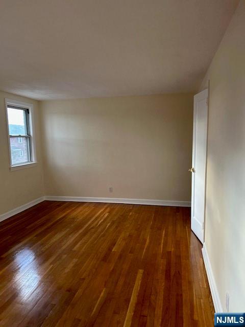 425 Ridge Road, Unit K North Arlington, NJ 07031 - Photo 3 of 6 a view of an empty room and wooden floor