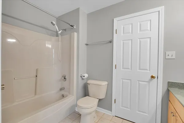 a bathroom with a toilet and a bathtub