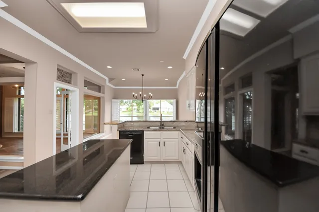 a bathroom with a tub and a window