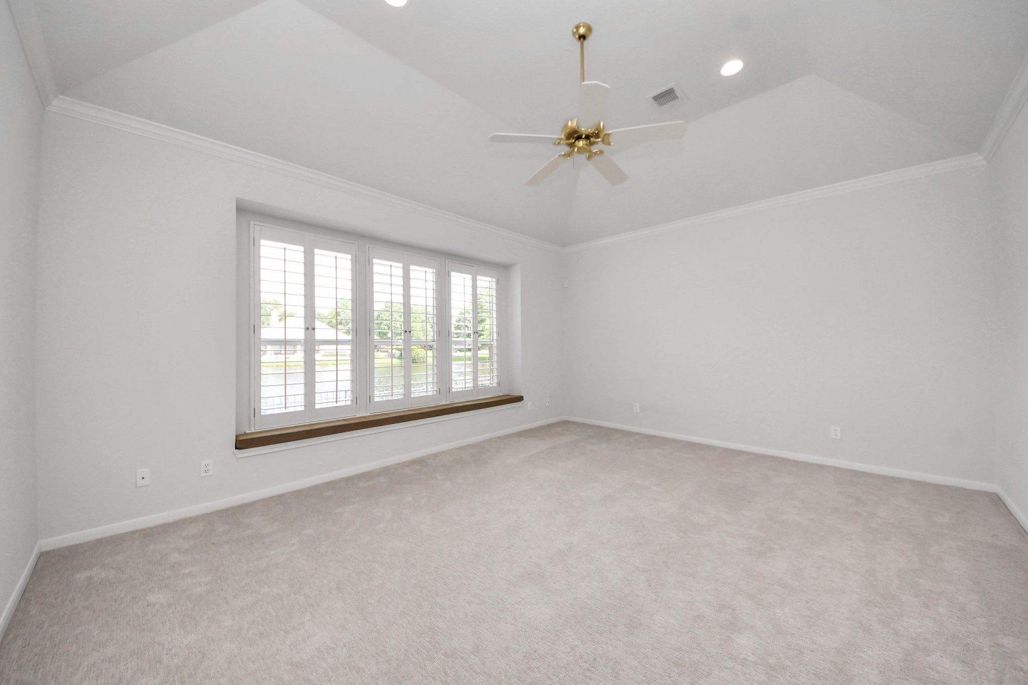 39 Wild Meadow Court The Woodlands, TX 77380 - Photo 18 of 41 wooden floor in an empty room with a window