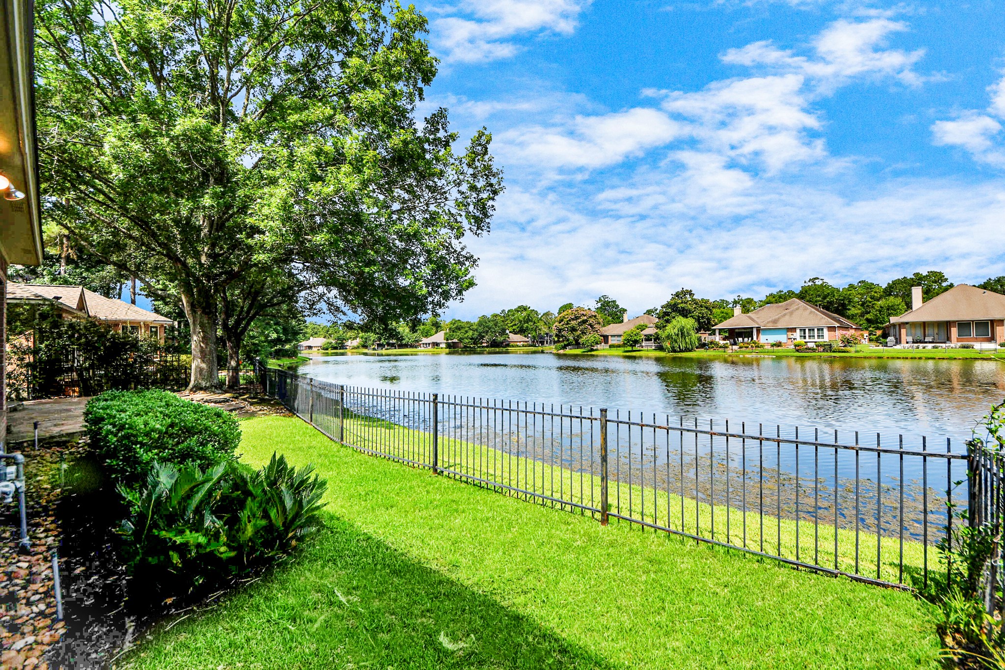39 Wild Meadow Court The Woodlands, TX 77380 - Photo 35 of 41 a view of a lake from a yard