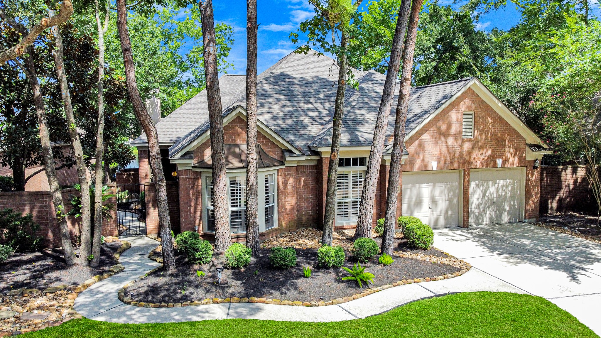 39 Wild Meadow Court The Woodlands, TX 77380 - Photo 41 of 41 a front view of a house with garden