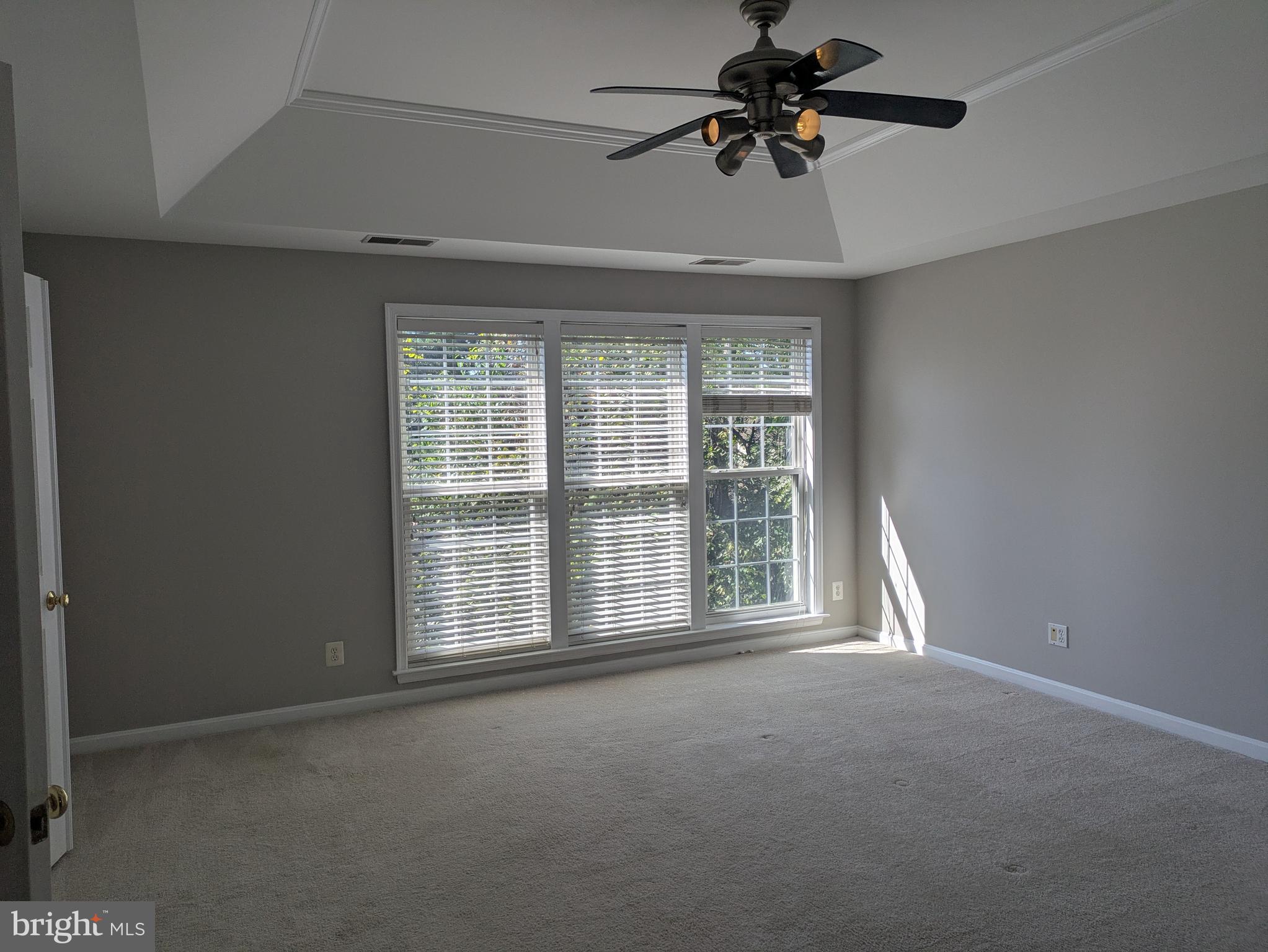 4016 Timber Oak Trail Fairfax, VA 22033 - Photo 38 of 67 a view of a livingroom with a ceiling fan and window