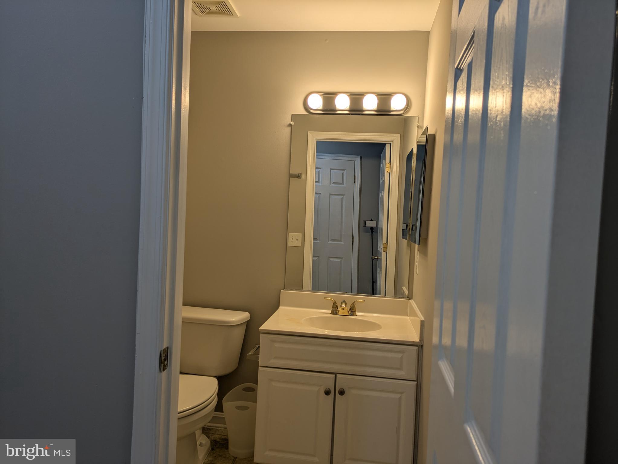4016 Timber Oak Trail Fairfax, VA 22033 - Photo 62 of 67 a bathroom with a sink and a mirror