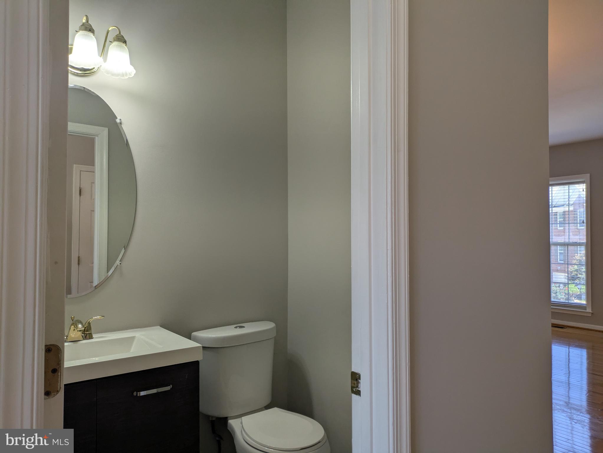 4016 Timber Oak Trail Fairfax, VA 22033 - Photo 10 of 67 a bathroom with a toilet a sink and mirror