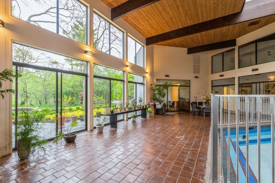 808 Prairie Road Glencoe, IL 60022 - Photo 2 of 14 a view of living room with furniture and floor to ceiling window