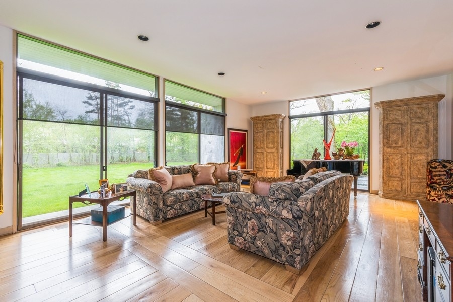 808 Prairie Road Glencoe, IL 60022 - Photo 5 of 14 a living room with furniture and a large window