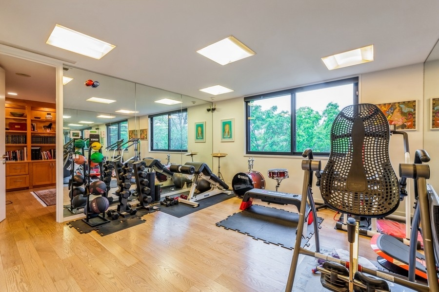 808 Prairie Road Glencoe, IL 60022 - Photo 8 of 14 a living room with furniture a window and gym equipment