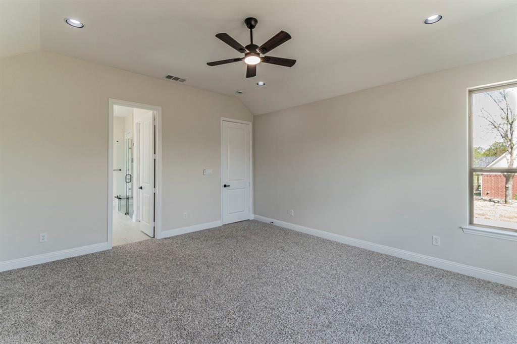 26 Kentucky Court Van Alstyne, TX 75495 - Photo 16 of 40 wooden floor in an empty room with a window