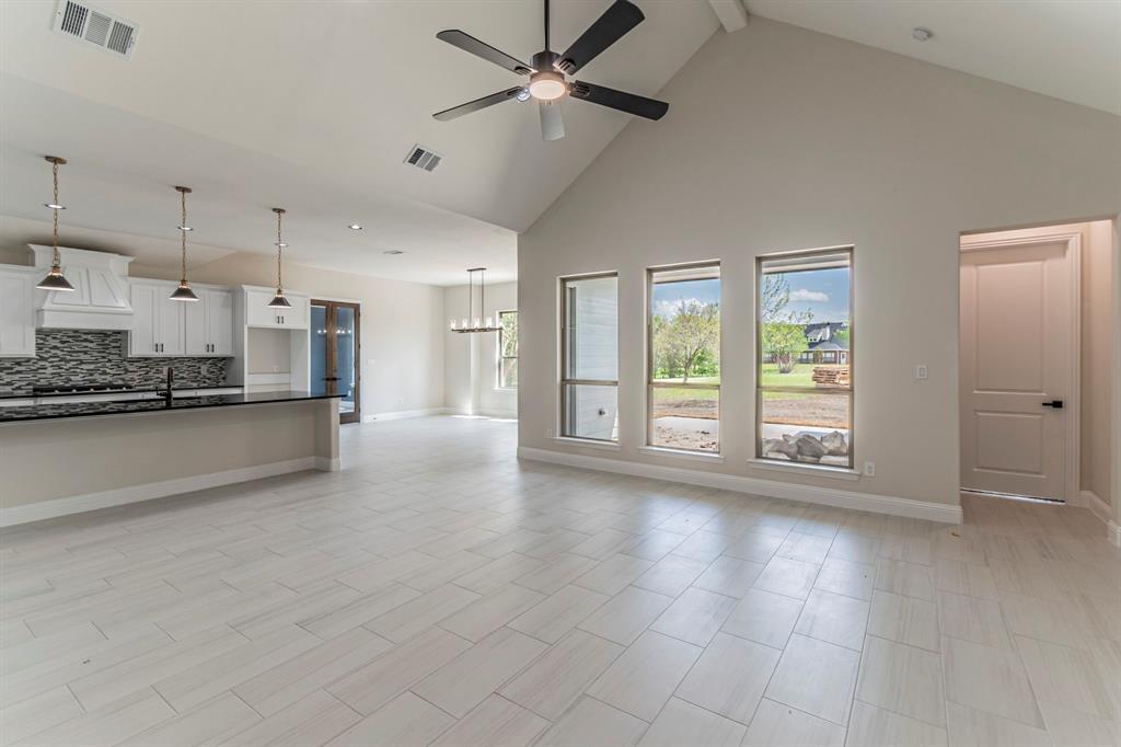 26 Kentucky Court Van Alstyne, TX 75495 - Photo 2 of 40 a view of a kitchen with a stove and a window