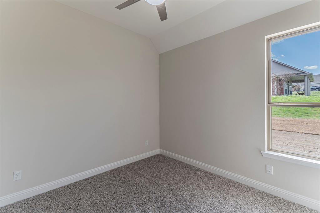 26 Kentucky Court Van Alstyne, TX 75495 - Photo 23 of 40 a room that has a window in it