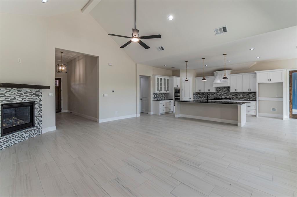 26 Kentucky Court Van Alstyne, TX 75495 - Photo 3 of 40 a large kitchen with cabinets and stainless steel appliances