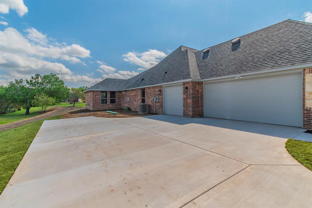 26 Kentucky Court Van Alstyne, TX 75495 - Photo 33 of 40 front view of a house with a street