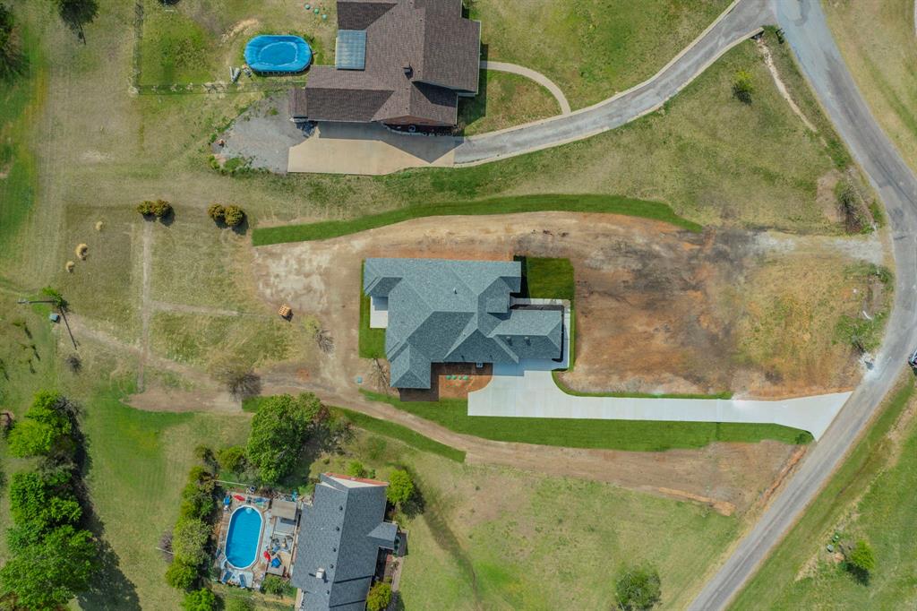 26 Kentucky Court Van Alstyne, TX 75495 - Photo 37 of 40 an aerial view of a house with a yard