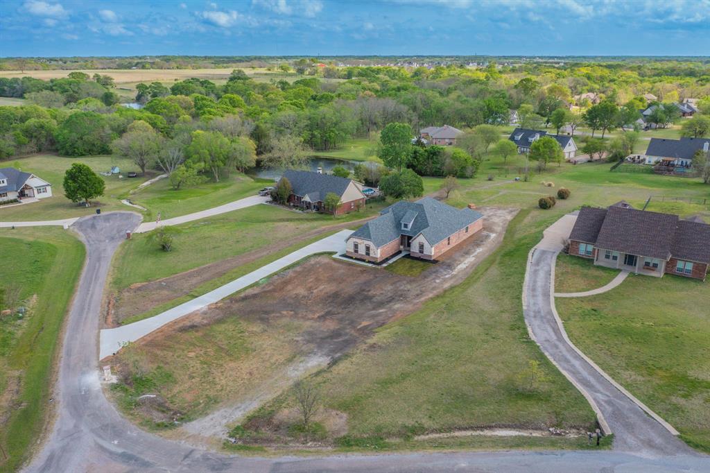 26 Kentucky Court Van Alstyne, TX 75495 - Photo 40 of 40 a view of a swimming pool and a yard