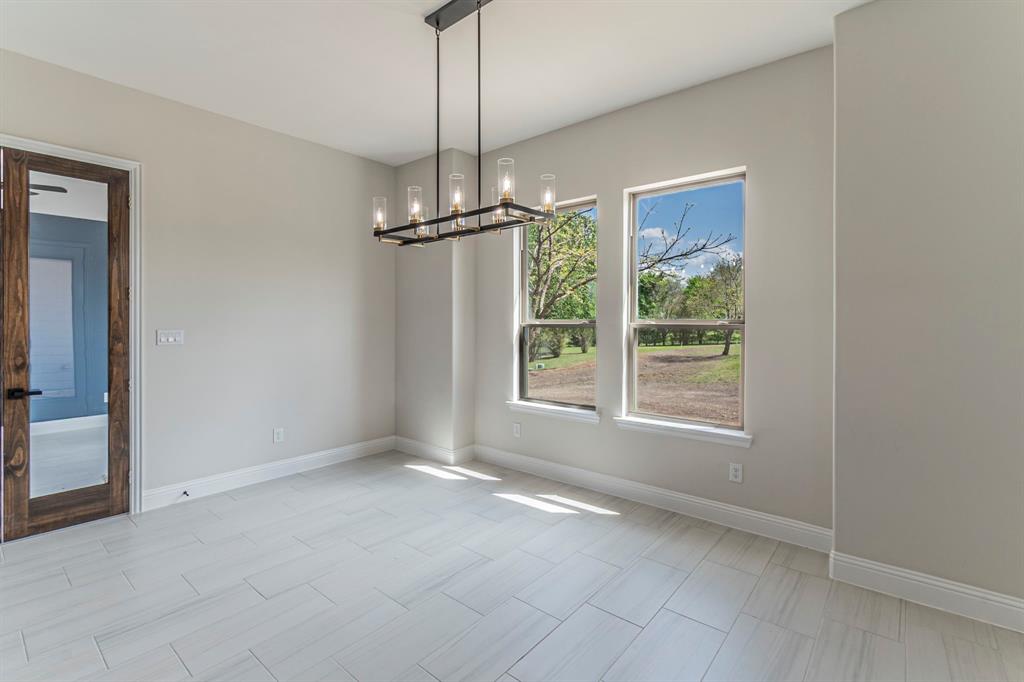 26 Kentucky Court Van Alstyne, TX 75495 - Photo 10 of 40 a view of an empty room with a window