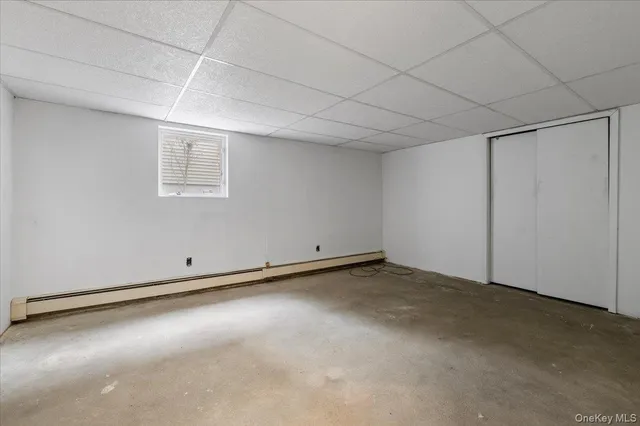 an empty room with a empty space and windows