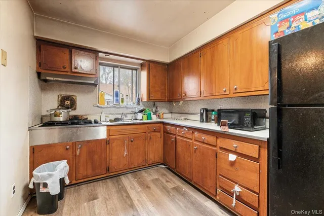 a bathroom with a sink vanity granite and toilet