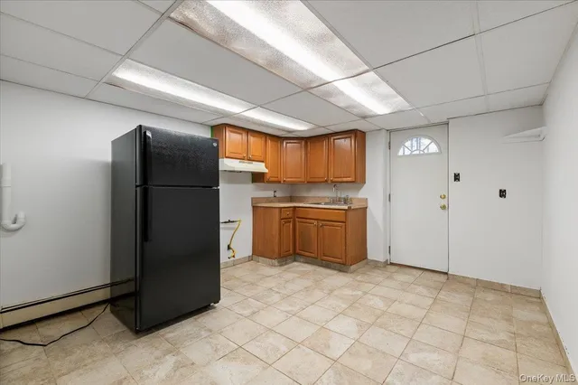 a kitchen with stainless steel appliances a refrigerator and a sink