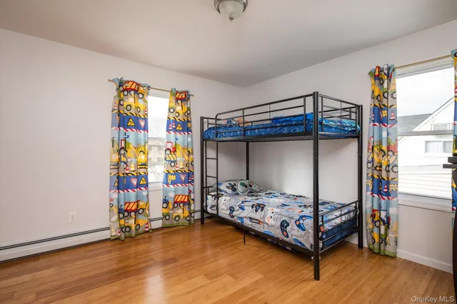 a bedroom with bed and a window