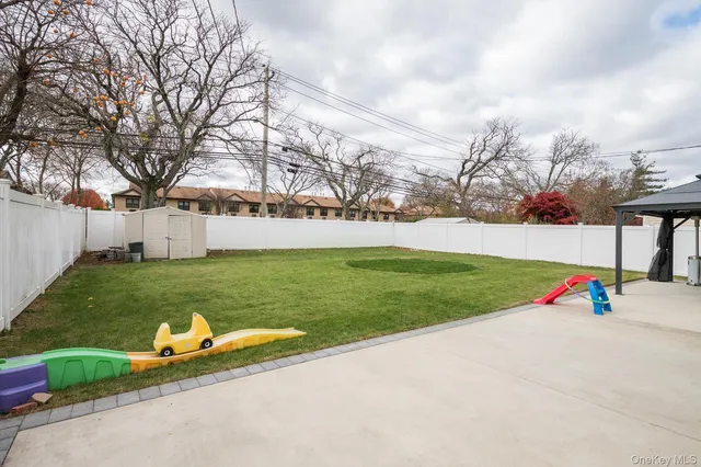 a view of a park with large trees