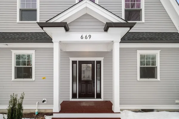 a front view of a house with a garage