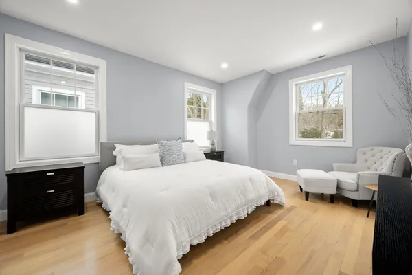 a bedroom with bed and window