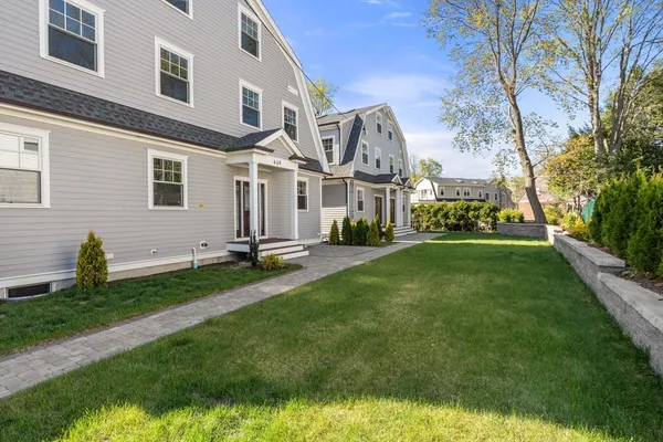 a front view of a house with a yard