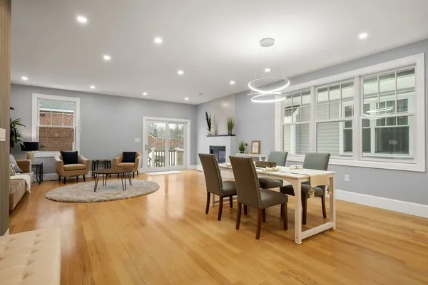 a view of a dining room with furniture and wooden floor