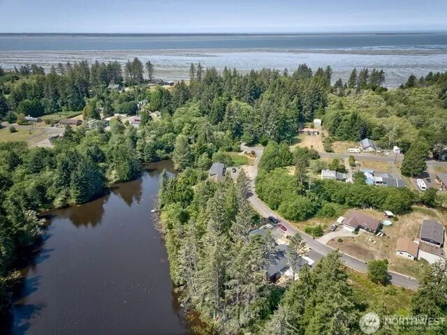 a view of a lake with beach and outdoor space