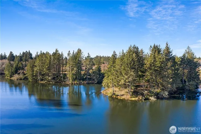 a view of a lake with houses with outdoor space