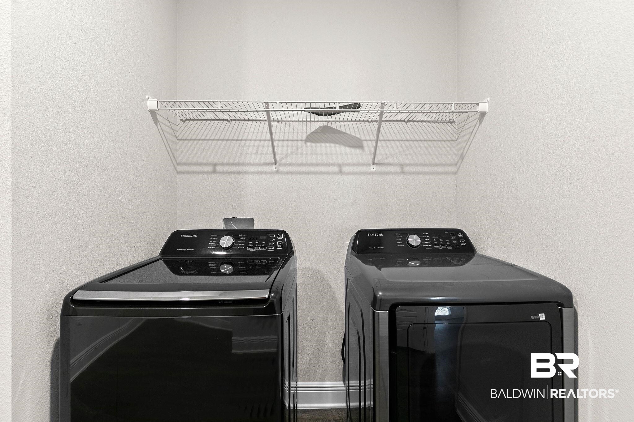 9448 Amethyst Drive Daphne, AL 36526 - Photo 46 of 61 Laundry room featuring a textured wall and washer and dryer