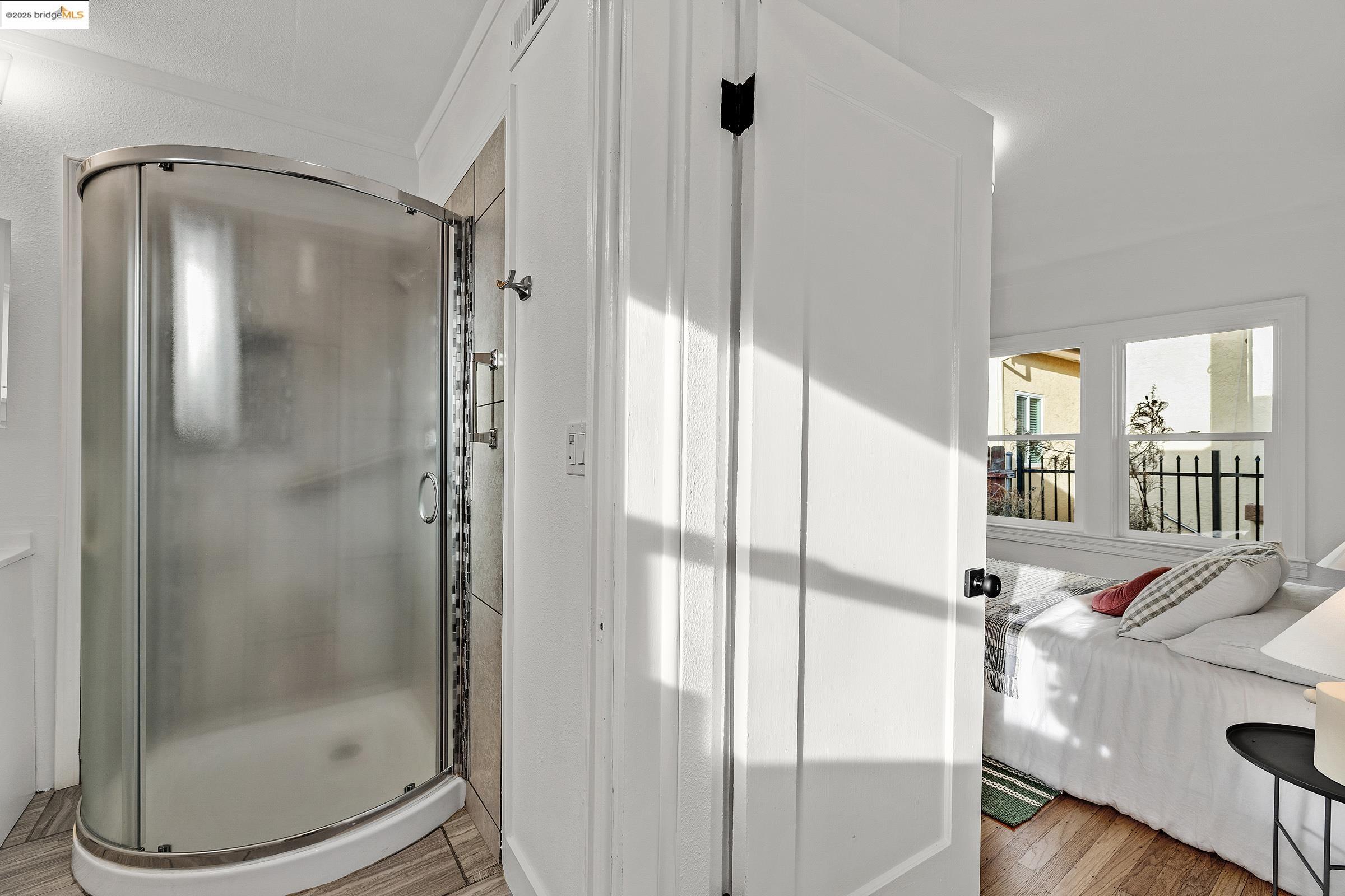 1515 B Derby Street Berkeley, CA 94703 - Photo 23 of 29 a bathroom with a glass shower door