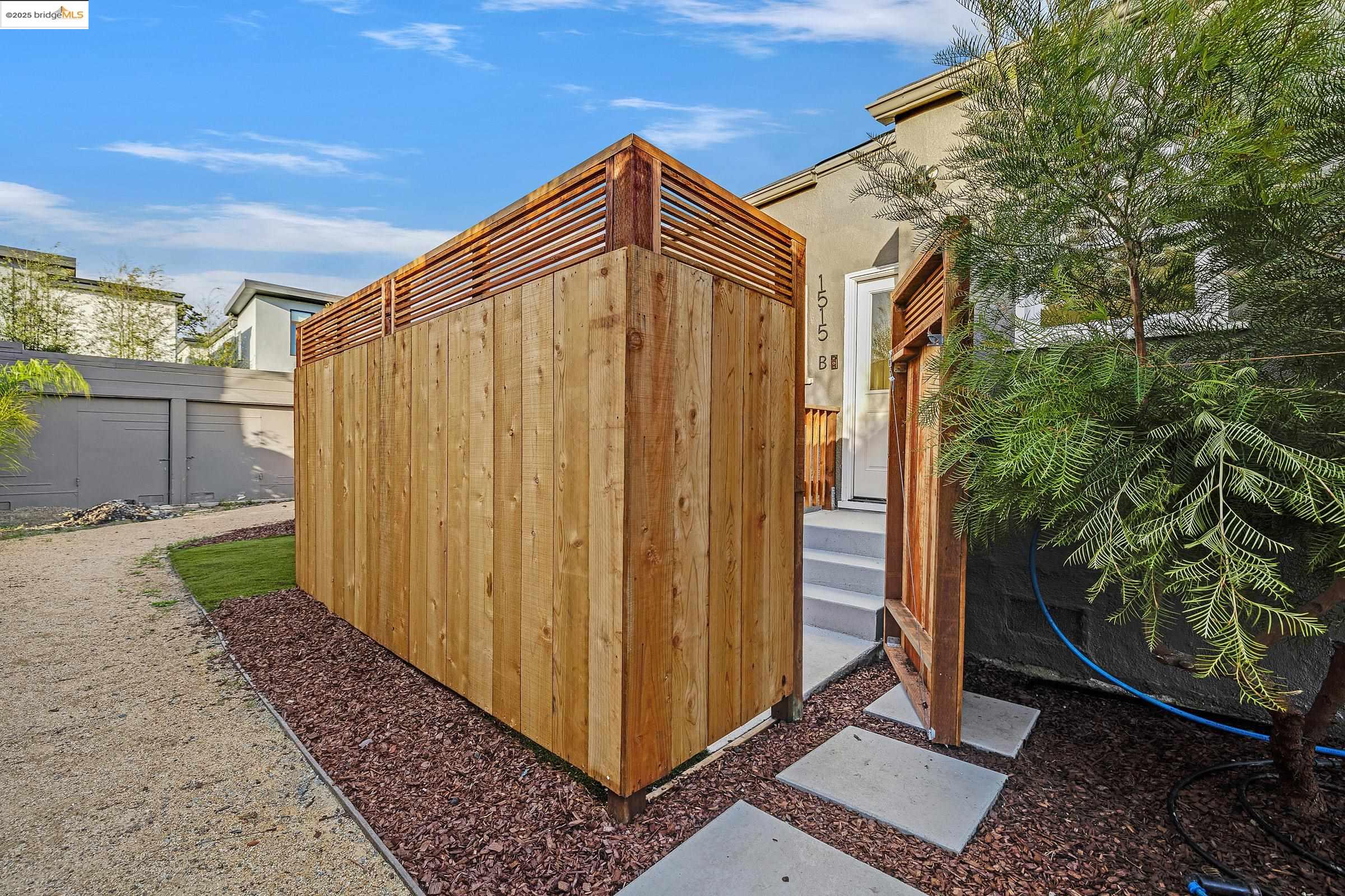 1515 B Derby Street Berkeley, CA 94703 - Photo 3 of 29 a blue door with yard and plants