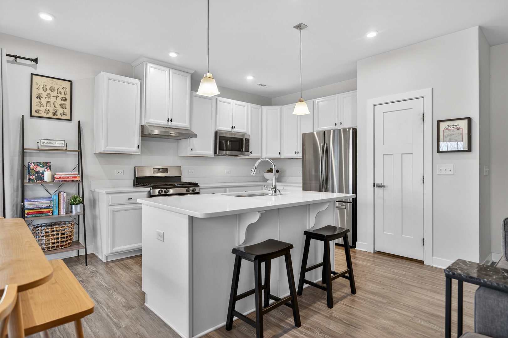 3656 Reddington Circle Elgin, IL 60124 - Photo 11 of 35 a kitchen with stainless steel appliances a stove a sink refrigerator and a refrigerator with wooden floor