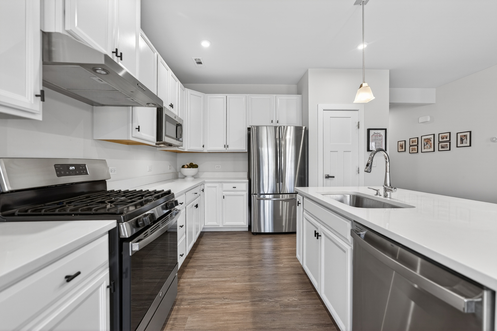 3656 Reddington Circle Elgin, IL 60124 - Photo 12 of 35 a kitchen with stainless steel appliances a sink stove and refrigerator