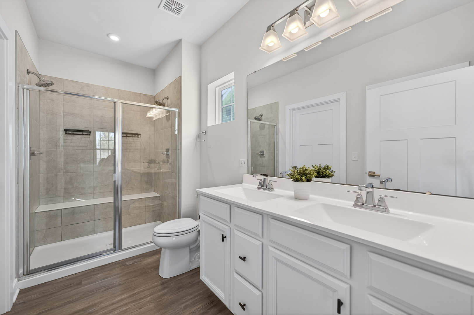3656 Reddington Circle Elgin, IL 60124 - Photo 21 of 35 a bathroom with a double vanity sink toilet and shower