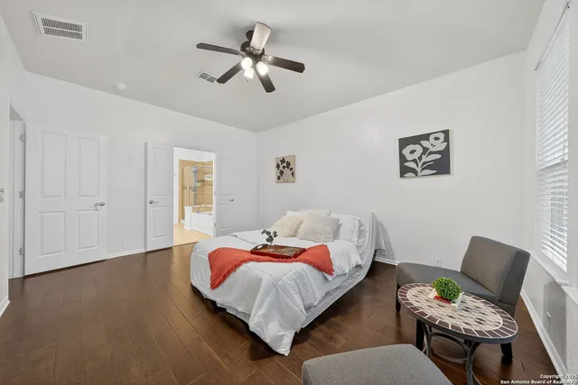 a bedroom with a bed furniture and window