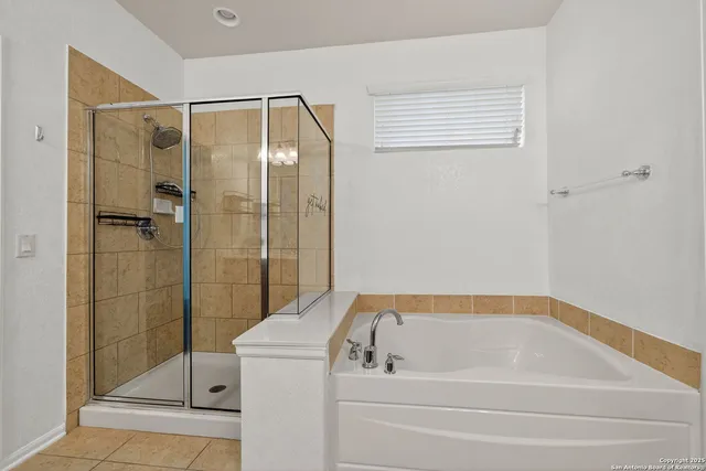 a bathroom with a shower and a bathtub