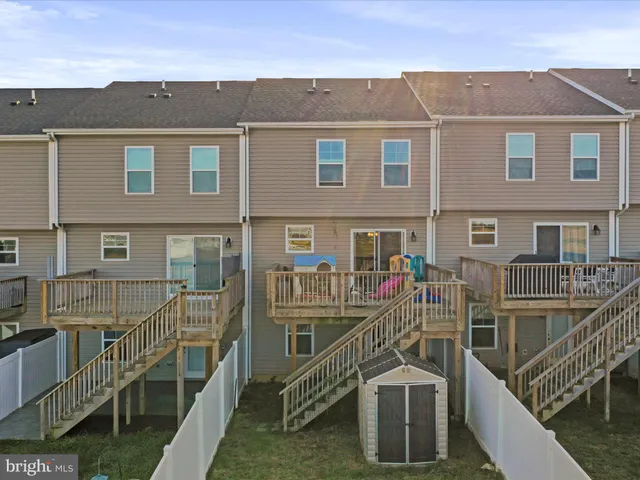 a view of a brick house with large windows