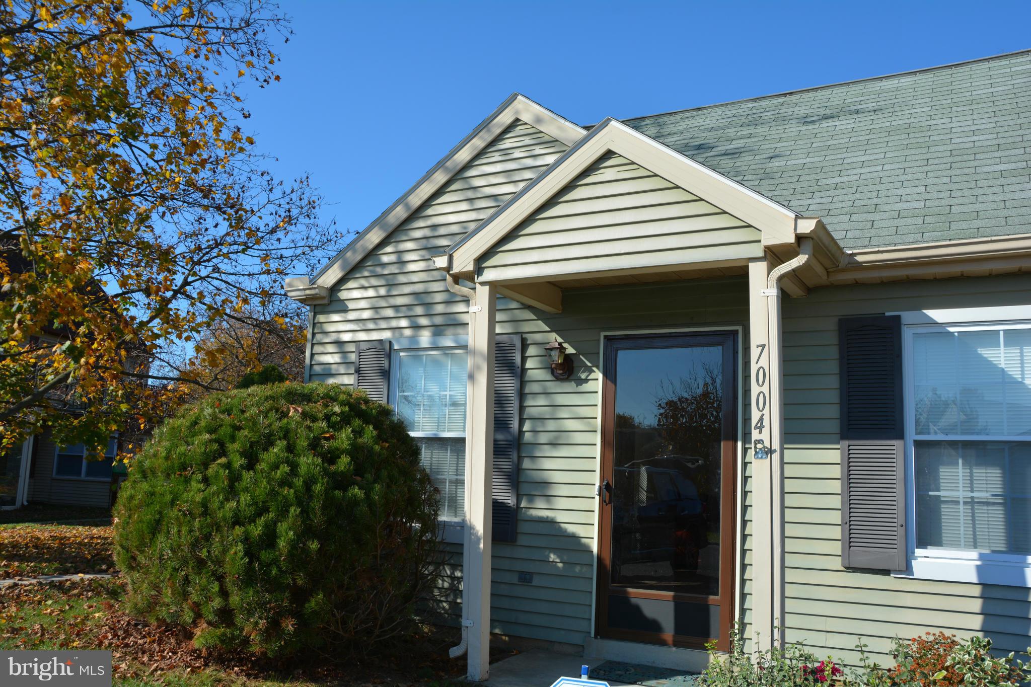 7004 Basswood Road Frederick, MD 21703 - Photo 1 of 16 a view of a house with a small yard